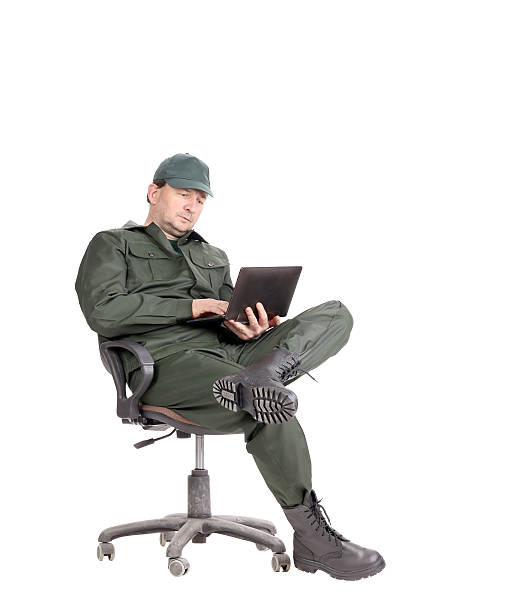 istock Man in workwear sitting with laptop. 188002461
