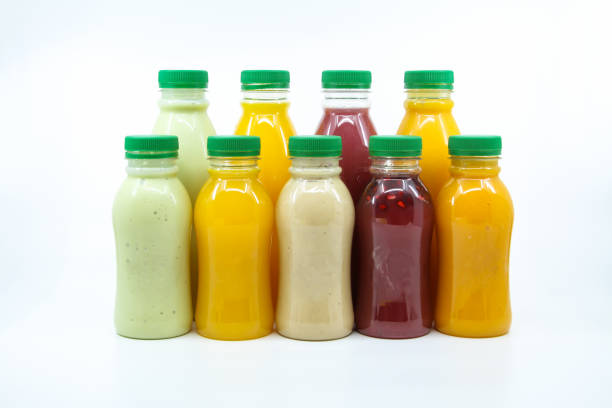 istock Assorted Juices of orange, mango, pomegranate, avocado and Dates milkshake served in bottle isolated on background side view of healthy morning juice drink 1880038725