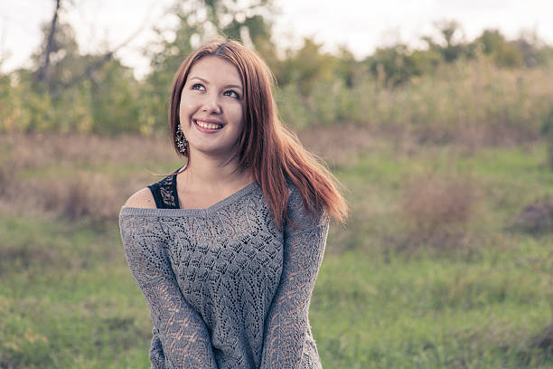 istock redhead weared gray sweater outdoors at autumn 188006919