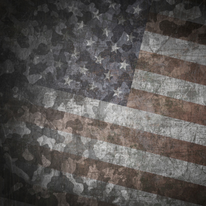 Grunge military background. Camouflage pattern over american flag, scratched