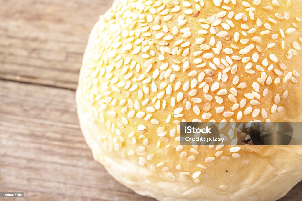 small bread round bread with sesame on  wooden table Backgrounds Stock Photo