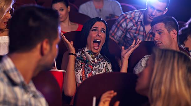 istock Young woman screaming at cinema 188007829
