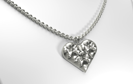 Silver heart shaped pendant with floral pattern on a chain. 3d illustration