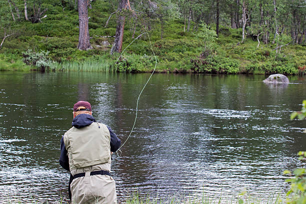 istock Fly fisherman seen from behind 188008073