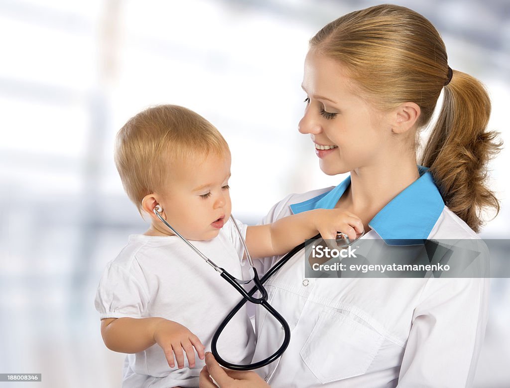 doctor pediatrician and patient happy child baby female doctor pediatrician and patient happy child baby Adult Stock Photo