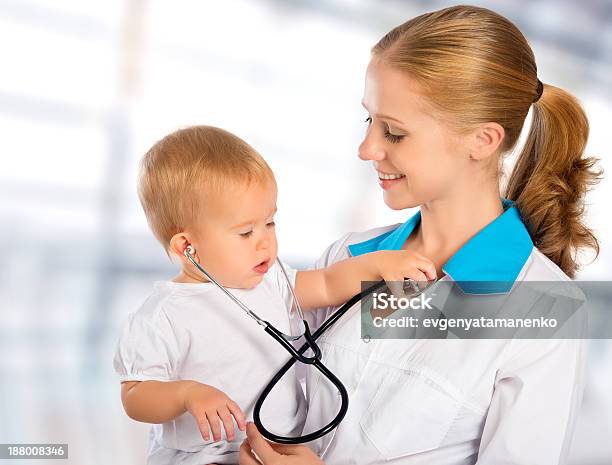 Doctor Pediatrician And Patient Happy Child Baby Stock Photo - Download Image Now - Adult, Assistance, Baby - Human Age