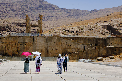 Persepolis, Iran-June 27, 2023: Entrance of Persepolis with iranian women.