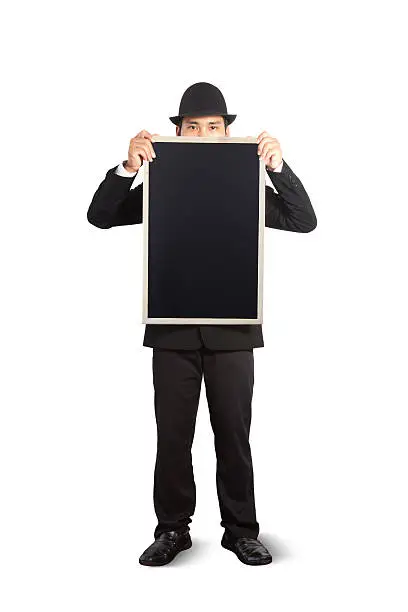 Businessman holding a blackboard in hands.