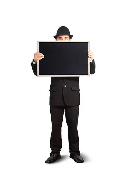 Businessman holding a blackboard in hands.