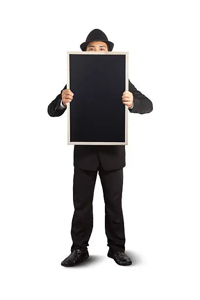 Businessman holding a blackboard in hands.