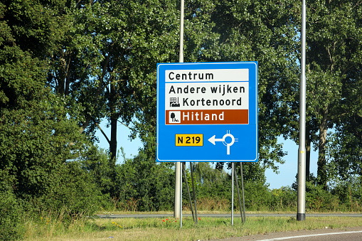 Direction signs at Nieuwerkerk aan den IJssel to local districts at N219 regional road in the Netherlands