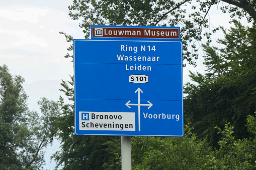 Direction signs to Wassenaar and Leiden at local S101 road in The Hague in the netherlands