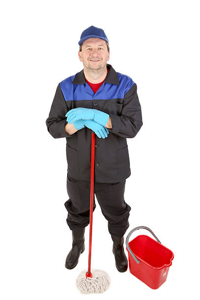 istock Worker holds broom with bucket. 188012311