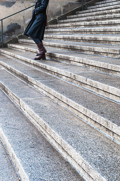 istock Woman walking up the stairs 188016189
