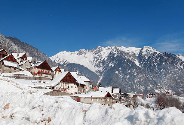 Winter landscape of Oz in French Alps. lot of snow in the village and the mountains.