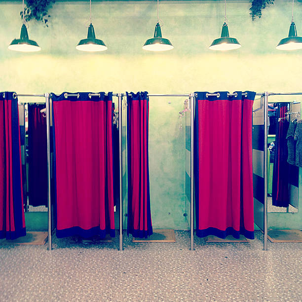 Fitting Rooms Fitting rooms inside a clothing store. Mobilestock photo: Photographed with iPhone 4S using Instagram. fitting room stock pictures, royalty-free photos & images