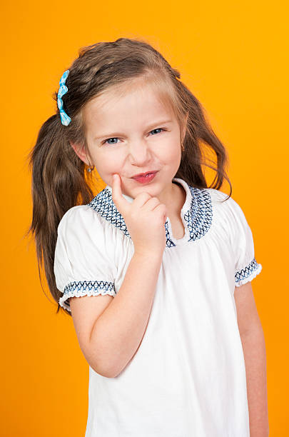 istock girl portrait on yellow 188018824