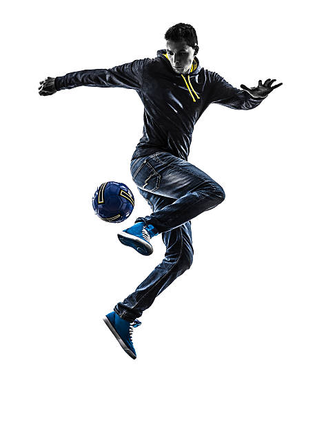 istock young man soccer freestyler player silhouette 188018993