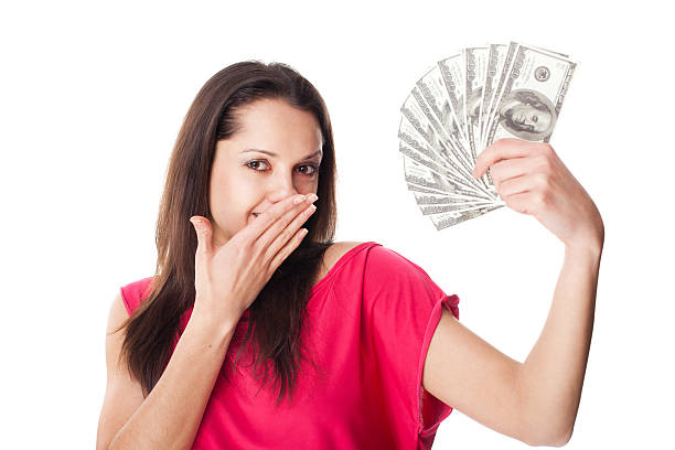 istock Young woman holding a dollar bills 188025246