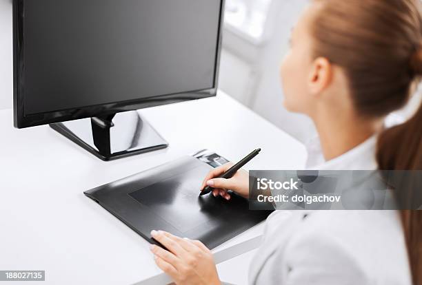 Businesswoman With Drawing Tablet In Office Stock Photo - Download Image Now - Adult, Adults Only, Beautiful People