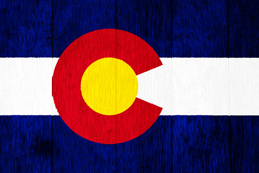 Flag of Colorado USA state on a textured background. Concept collage.