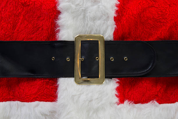 Santa's red and white suit with belt Santa Claus' red and white furry coat with a black belt and brass buckle belt stock pictures, royalty-free photos & images