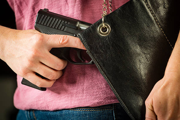 istock Woman Carrying Handgun 188034971