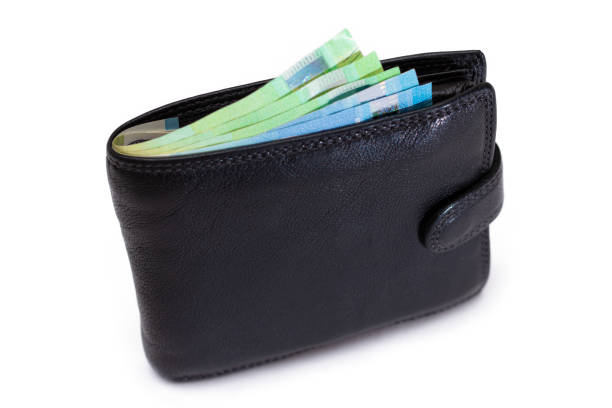 istock Black Leather Men Wallet with Euro Banknotes Inside - Isolated on White 1880371567