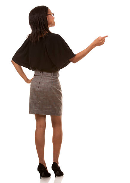 Rear view of businesswoman pointing awayhttp://www.twodozendesign.info/i/1.png