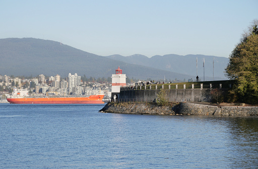 The Seawall and Brockton Point Lighthouse at Stanley Park during a fall season in Vancouver, British Columbia, Canada.