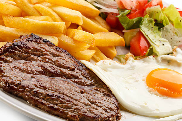 istock Beefsteak, fried egg, French fries and vegetables 188044243