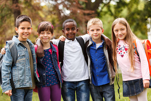 istock Group of happy elementary friends together 188045292