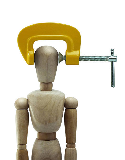 wooden mannequin wooden man with yellow c-clamp c clamp photos stock pictures, royalty-free photos & images