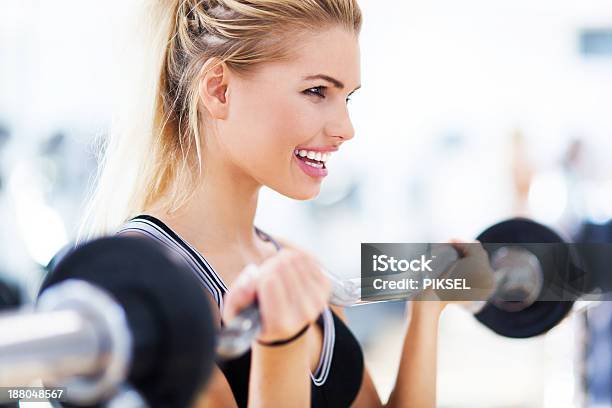 Woman Lifting Weights Stock Photo - Download Image Now - Adult, Adults Only, Anaerobic Exercise