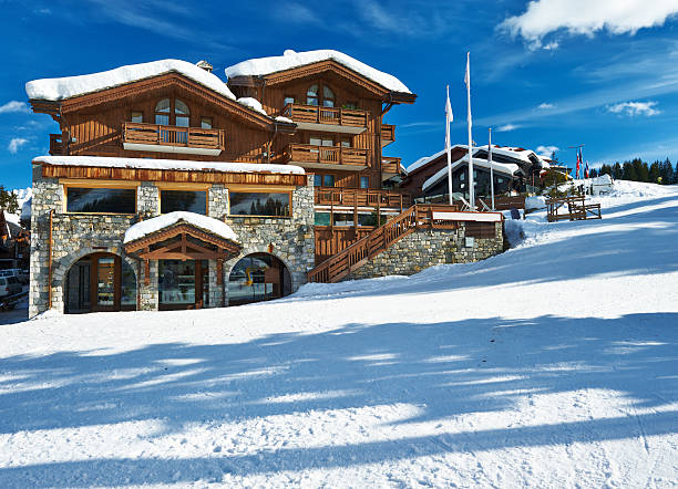 Mountain ski resort Mountain ski resort with snow in winter, Courchevel, Alps, France chalet photos stock pictures, royalty-free photos & images