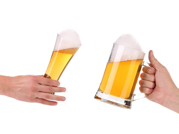istock Pair of very cool beer glasses making a toast. 188051251