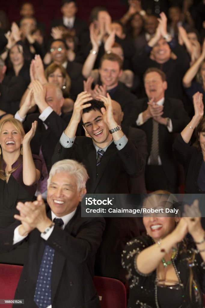 Enthusiastic theater audience clapping and cheering  Applauding Stock Photo