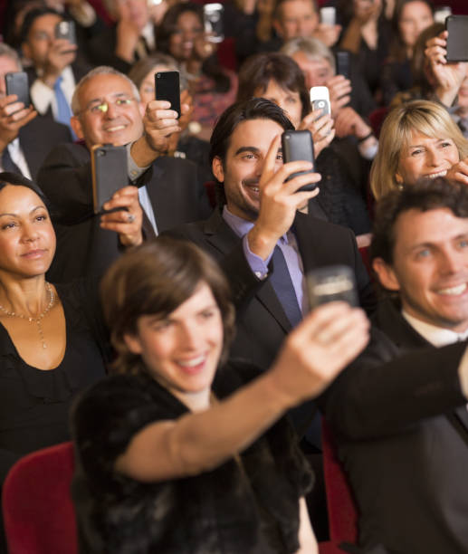 istock Theater audience videoing performance with smart phones 188051580