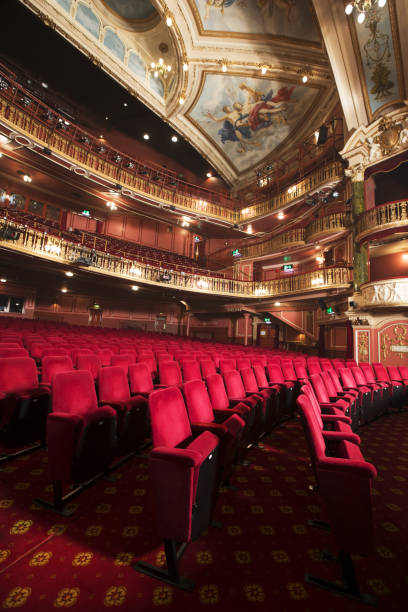 istock Balconies, seats and ornate ceiling in empty theater auditorium 188051585
