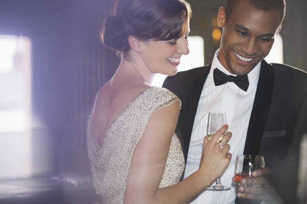 istock Well dressed couple drinking champagne and cocktail 188051616