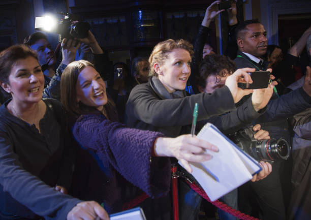 istock Fans reaching for autographs at red carpet event 188051637