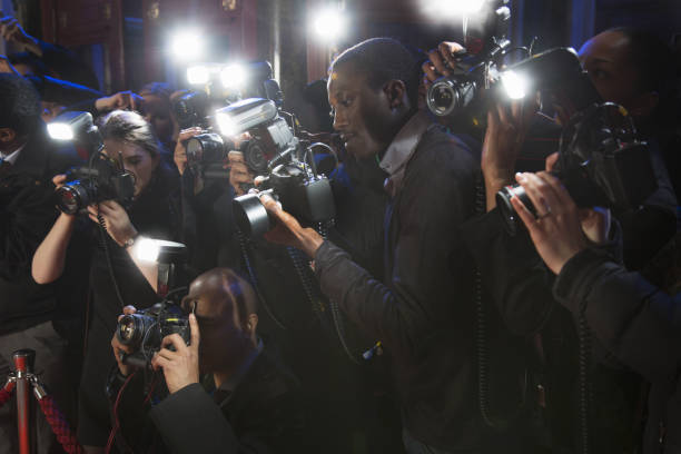 istock Paparazzi using flash photography at red carpet event 188051845