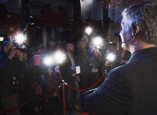 istock Bodyguard watching paparazzi at red carpet event 188051847