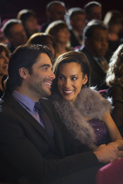 istock Smiling couple in theater audience 188051932