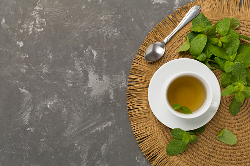 Fresh mint tea on concrete background,top view