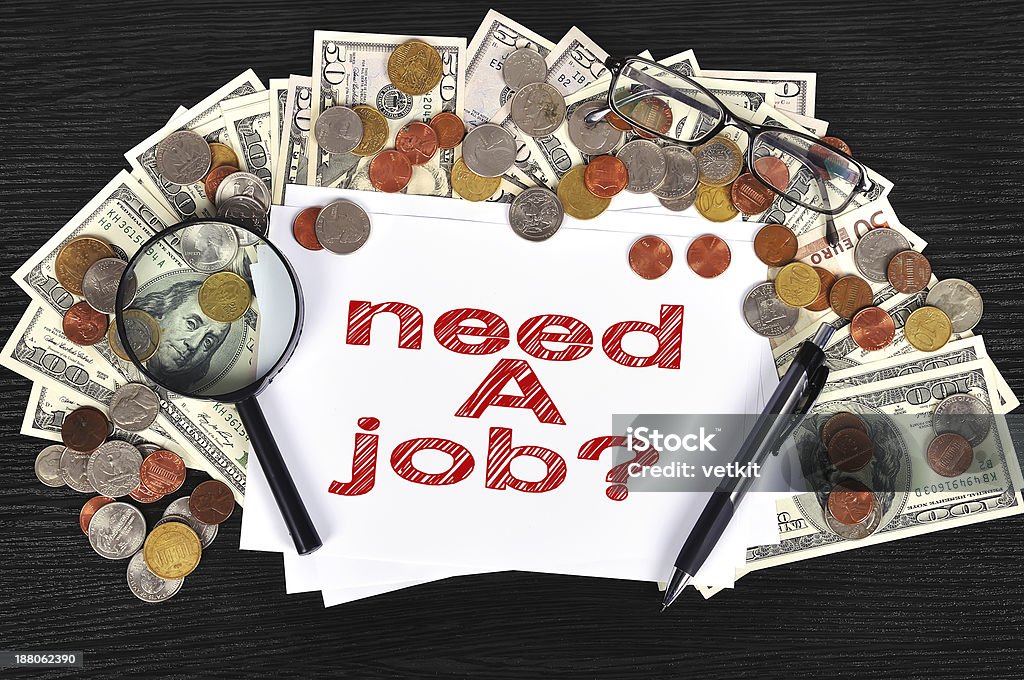 need a job money on table and paper with need a job Achievement Stock Photo
