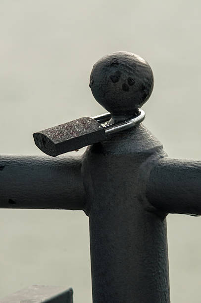 istock clipped a padlock to the bridge 188062457