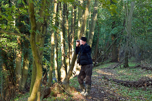 istock Man in the countryside bird watching 188063458