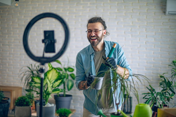 istock Vlogger making a video on diy gardening tips 1880640087