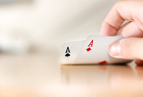 Brand new deck of pocker cards on white background. Ace of hearts on top. Studio shot. This is an exclusive image and it can only be found in iStockphoto.